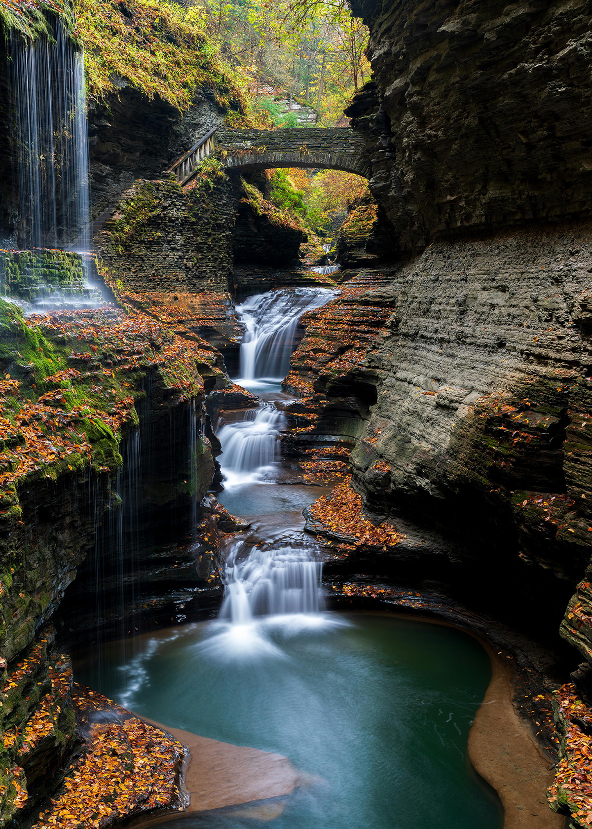 Photo by James Mirakian: https://www.pexels.com/photo/rainbow-bridge-and-falls-at-watkins-glen-state-park-watkins-glen-new-york-usa-19051790/